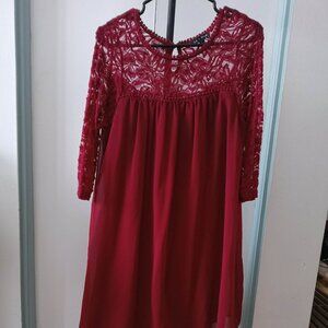 Beautiful dress in a rich burgundy red with lace sleeves with petticoat